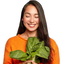 girl smilling with vegetables